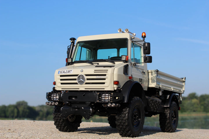 UNIMOG 3.250 mit Kippbrücke und Fronthydraulik